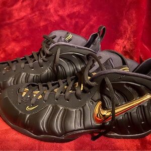 Nike Black and Gold Sneakers with Sleek Design